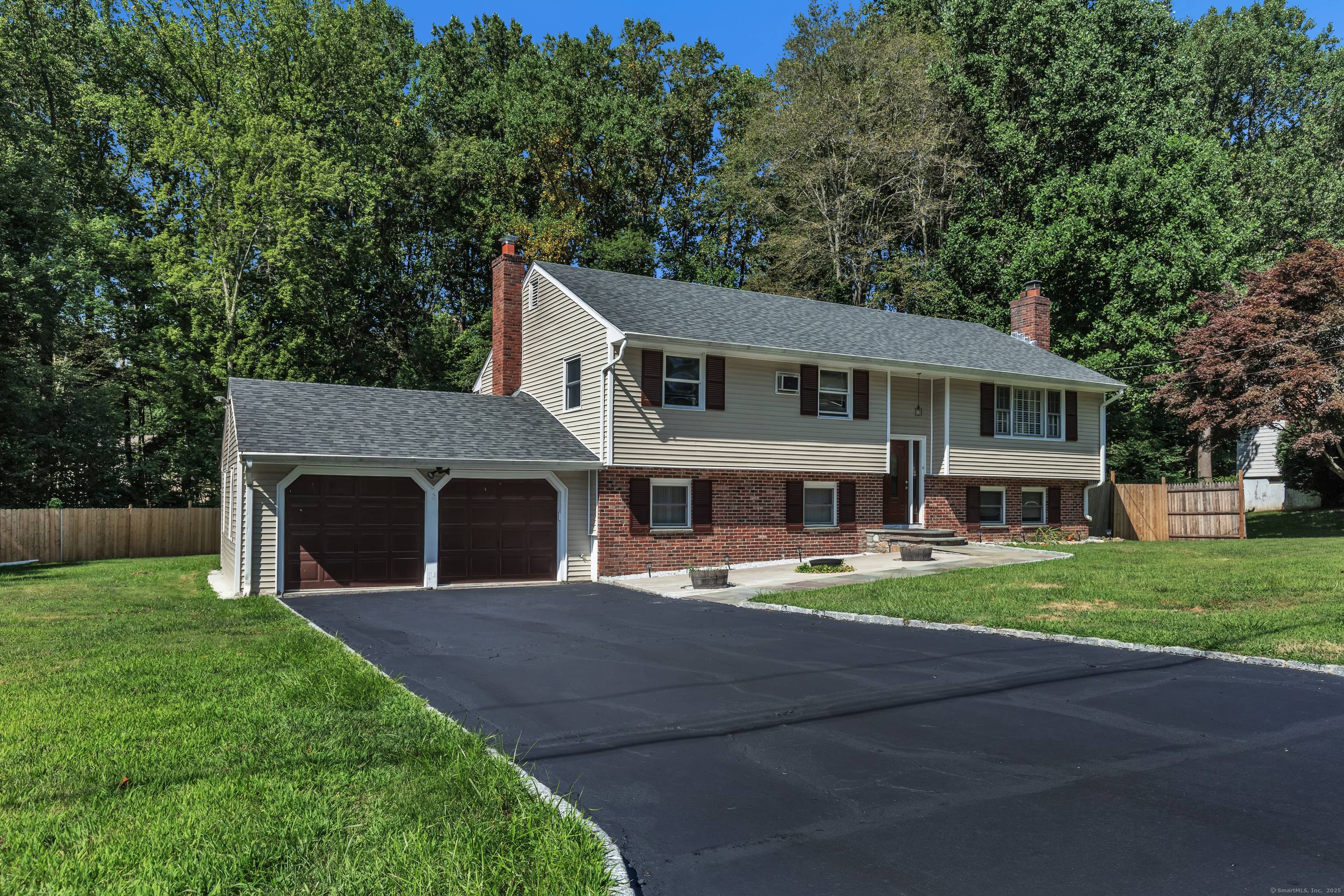 Welcome to this beautifully maintained raised ranch nestled in a quiet residential neighborhood in desirable Trumbull.