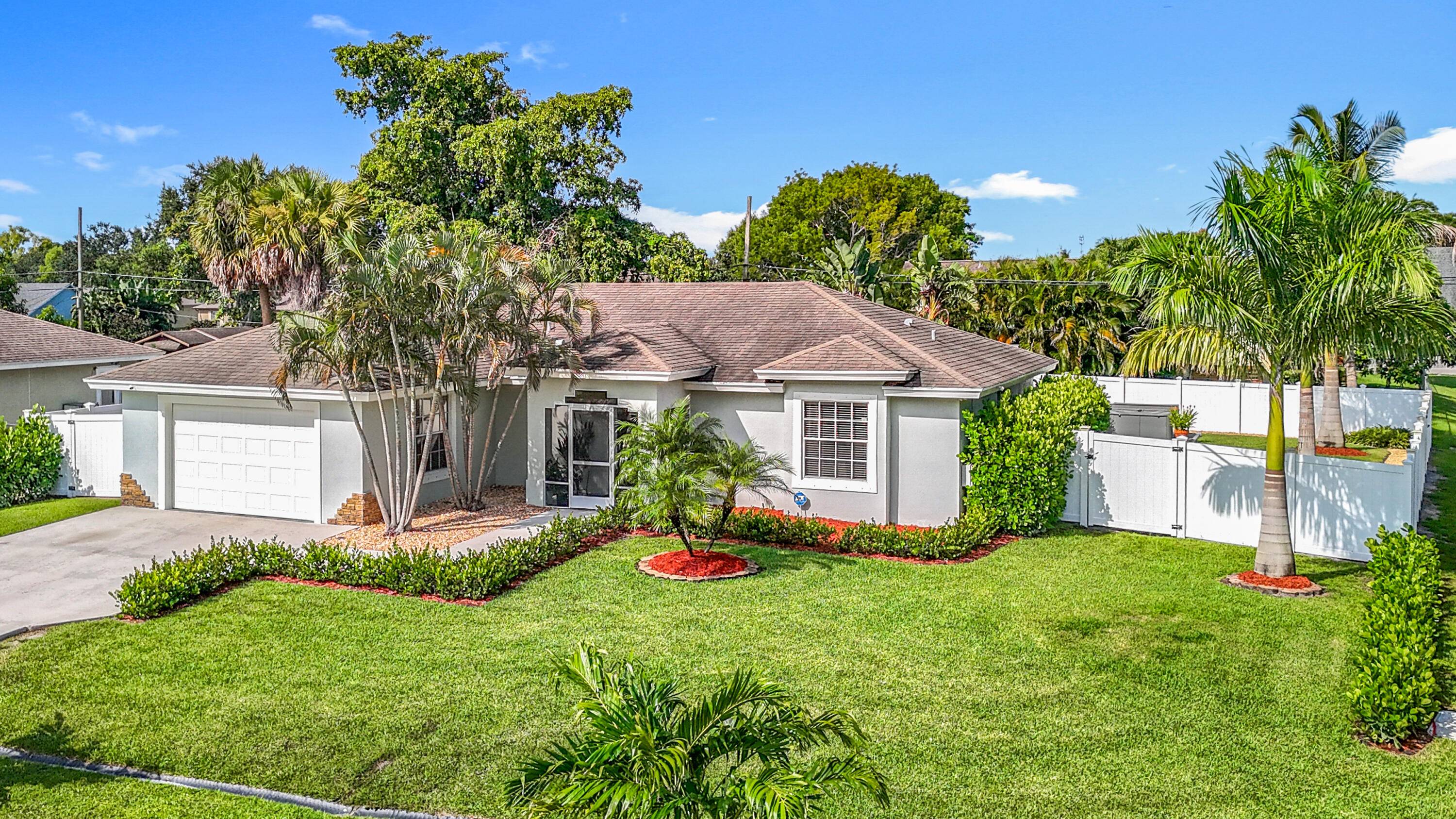 Step into a completely remodeled home on an oversized corner lot with NO HOA in the center of Port St Lucie.