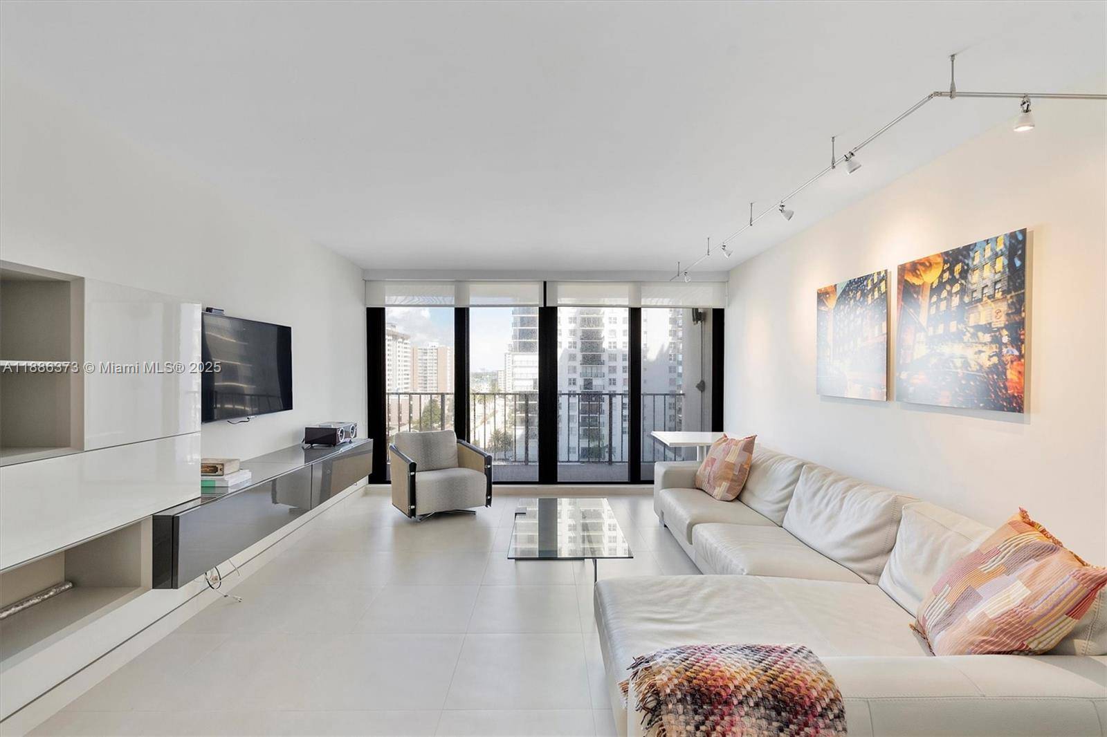 Experience the best of oceanfront living in this bright 2 bed, 2 bath corner unit at Britannia at Quadomain in Hollywood Beach.