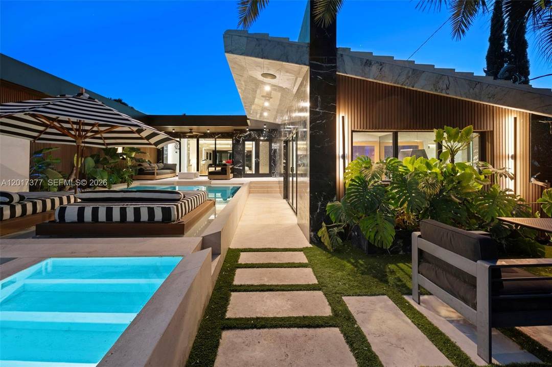 Stunning Mid Century Modern Home nestled away on private La Gorce Country Club.