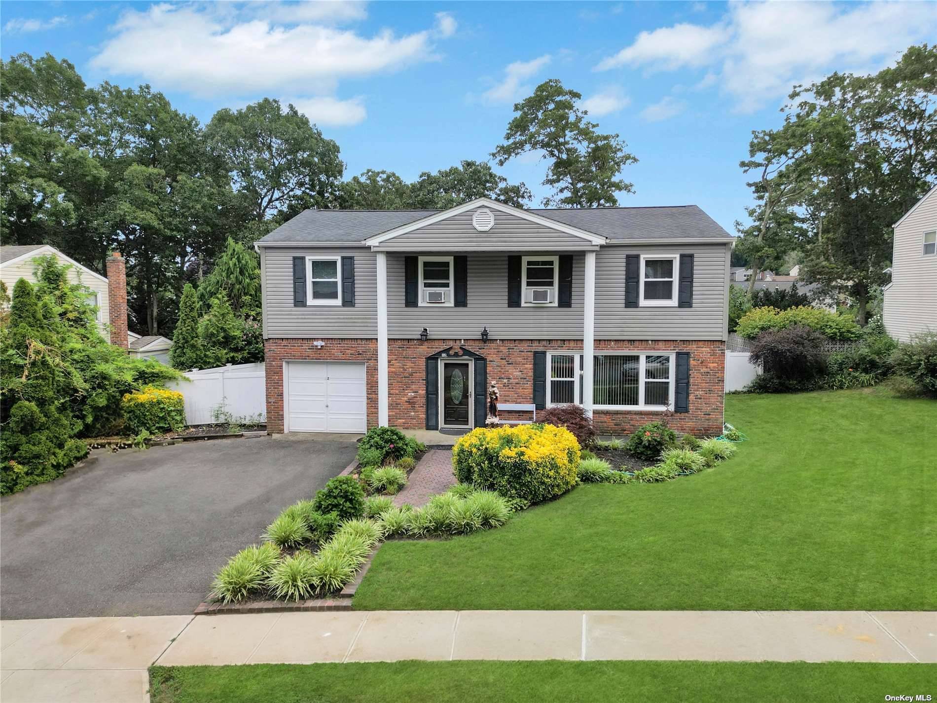 Incredible opportunity ! Magnificent Colonial, large foyer, Large living room and formal dining room featuring newer hardwood floors.
