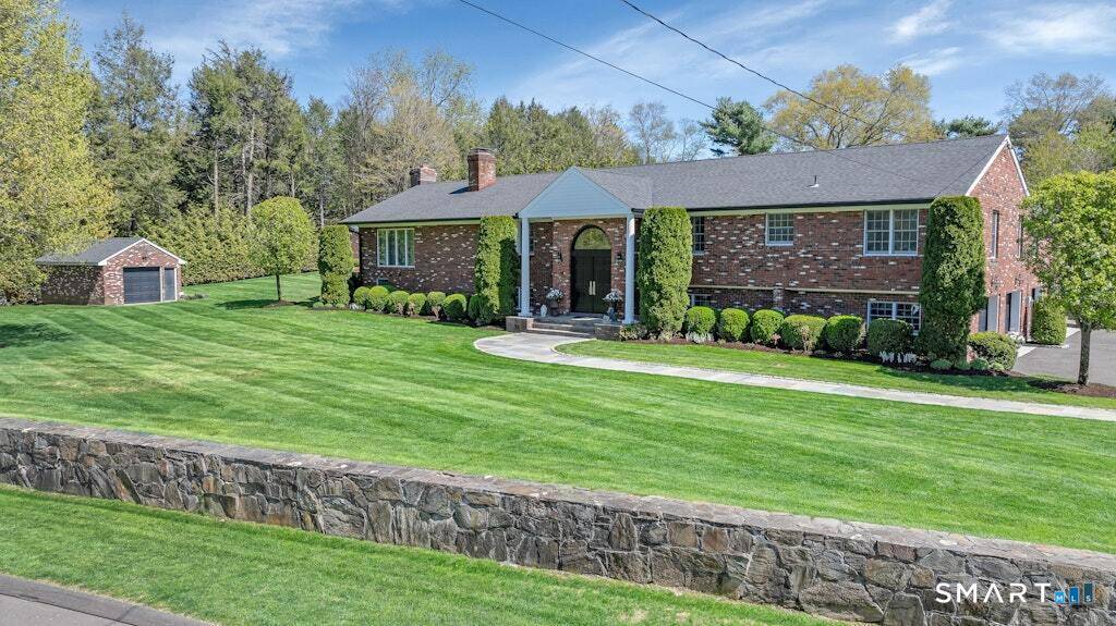 Welcome to 20 Brushwood Road, a beautifully renovated modern home set in one of Stamford's most peaceful residential neighborhoods.