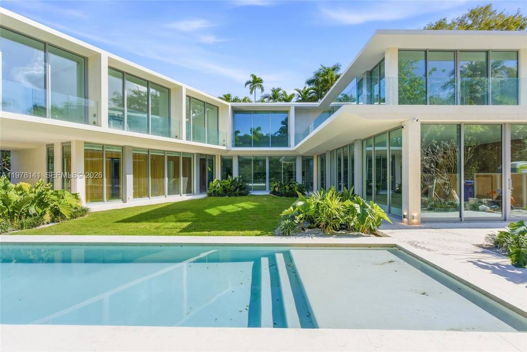 A truly spectacular tropical modern estate in Coconut Grove, this architectural statement blends cutting edge design, lush tropical surroundings, and seamless indoor outdoor living to create a home that feels ...
