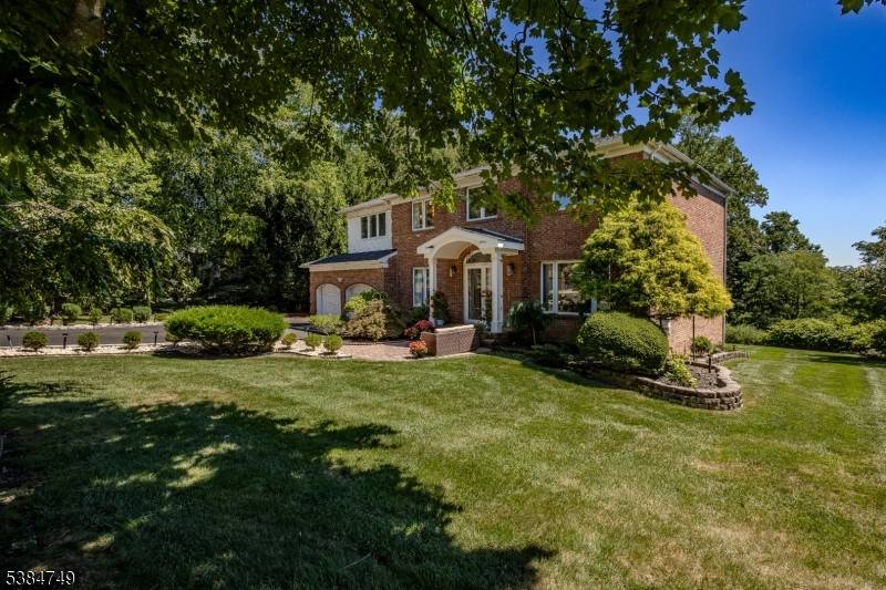 Discover this stunning move in ready, partially furnished Colonial with private views in Cinnamon Ridge, featuring 4 BRs an office, perfect for modern living.
