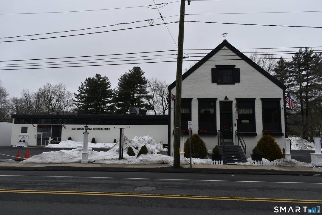 Remodeled and update commercial building with 3 possible economic units, office, warehouse and residential apartment with attached gym.