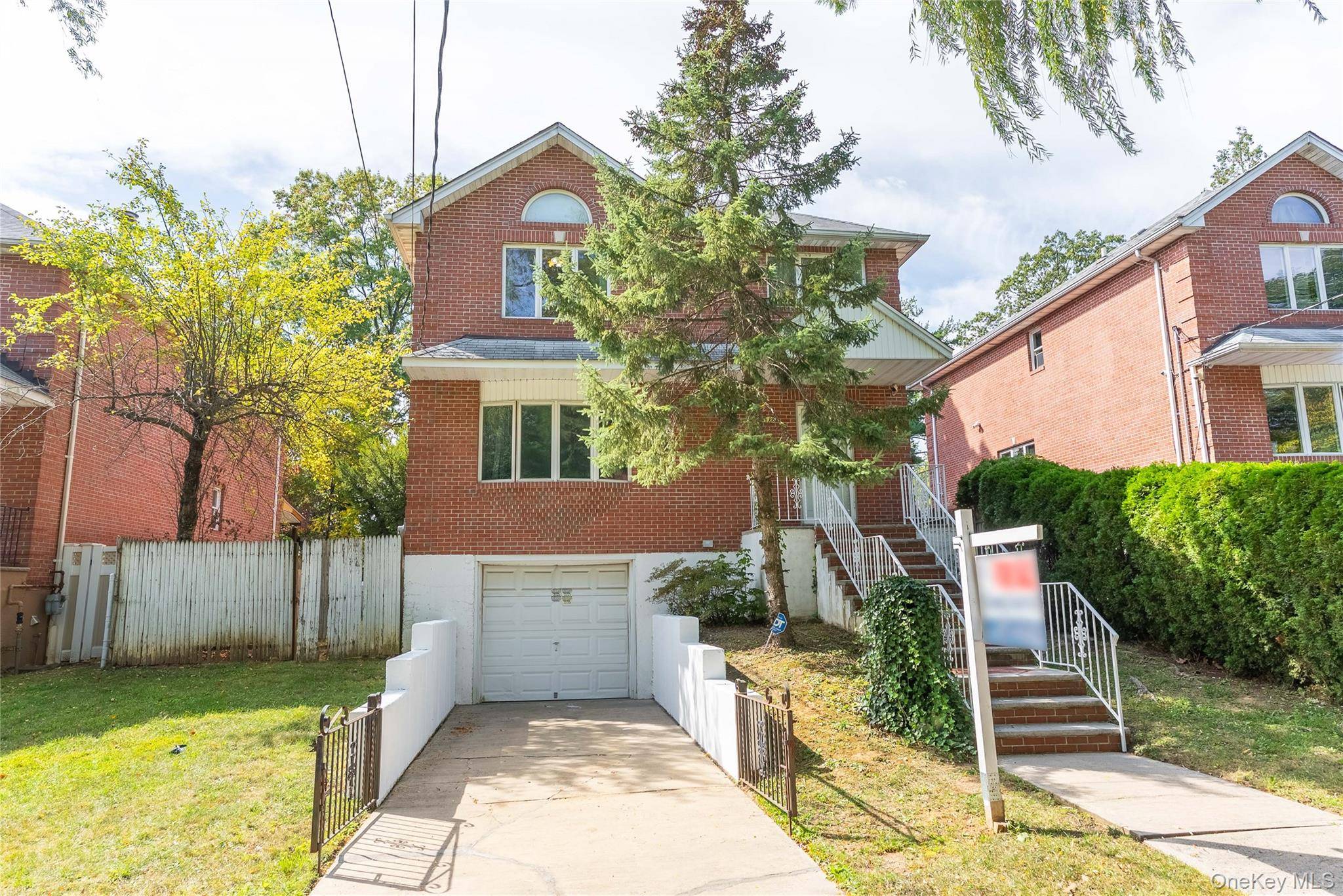 Welcome to this charming brick colonial home located in the heart of Hollis, Queens.
