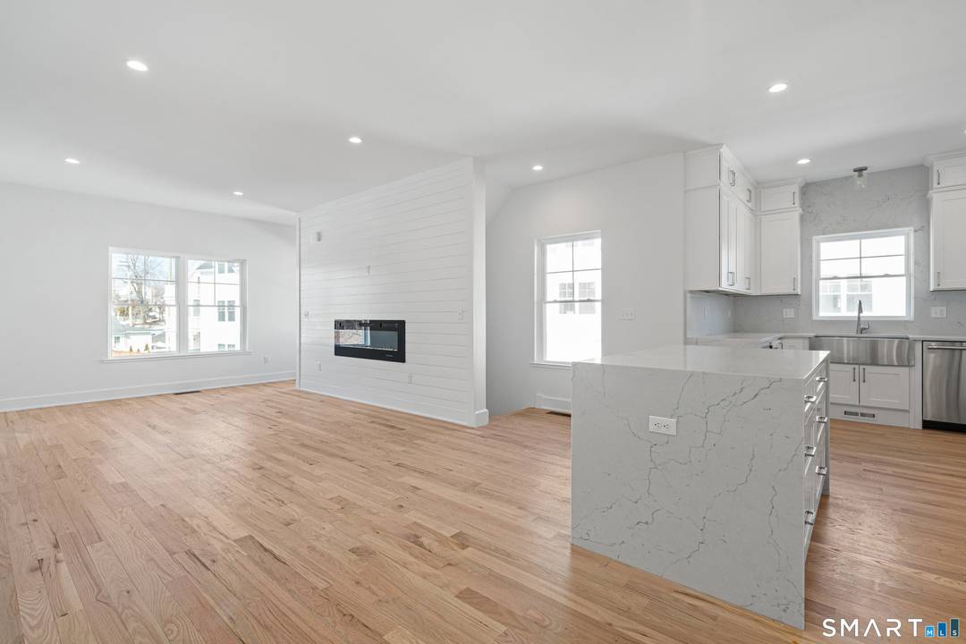 Elevated coastal living awaits in this newly constructed 4 bedroom, 3 bath luxury townhouse just moments from Woodmont Beach.