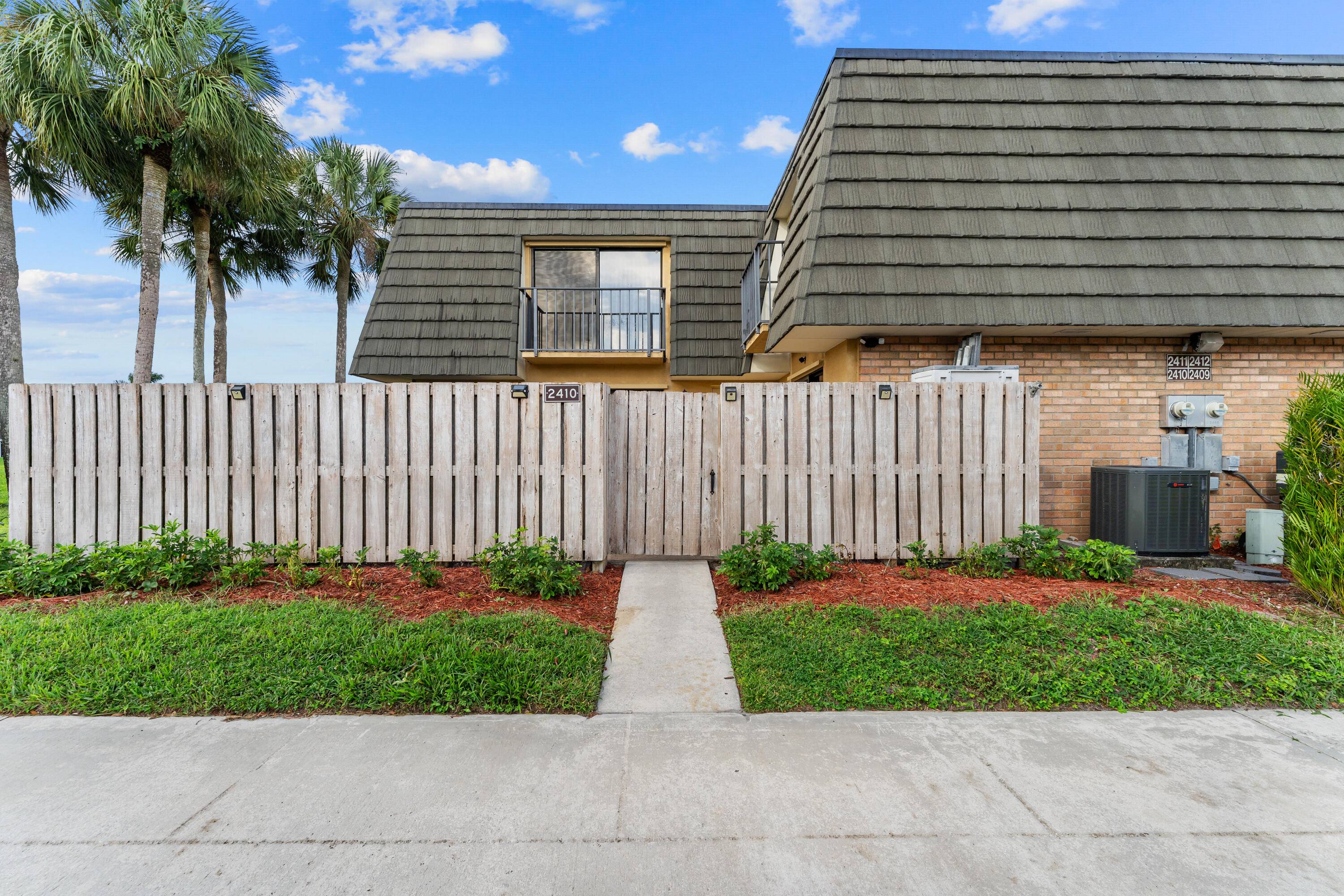 Beautiful corner lakefront townhome in the sought after Sandalwood Lakes community !