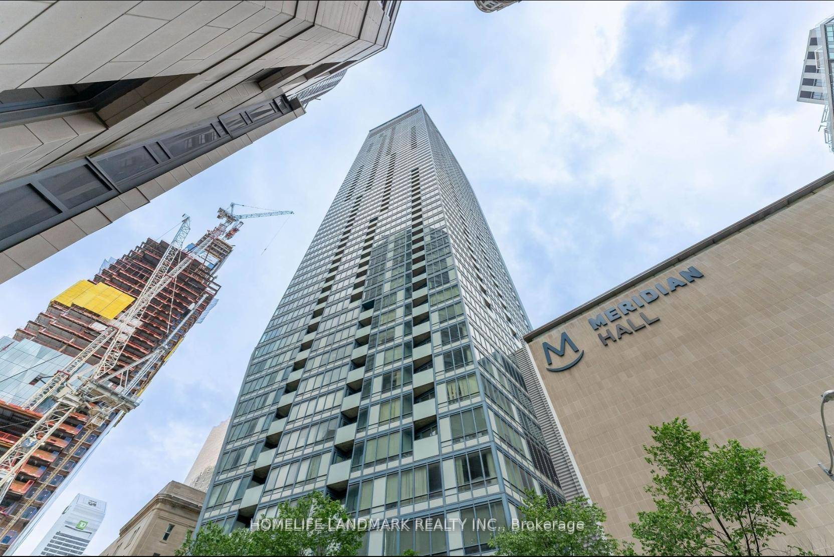 Welcome to this stunning 2 bedroom corner suite at the renowned L Tower, ideally situated just steps from Union Station, St.
