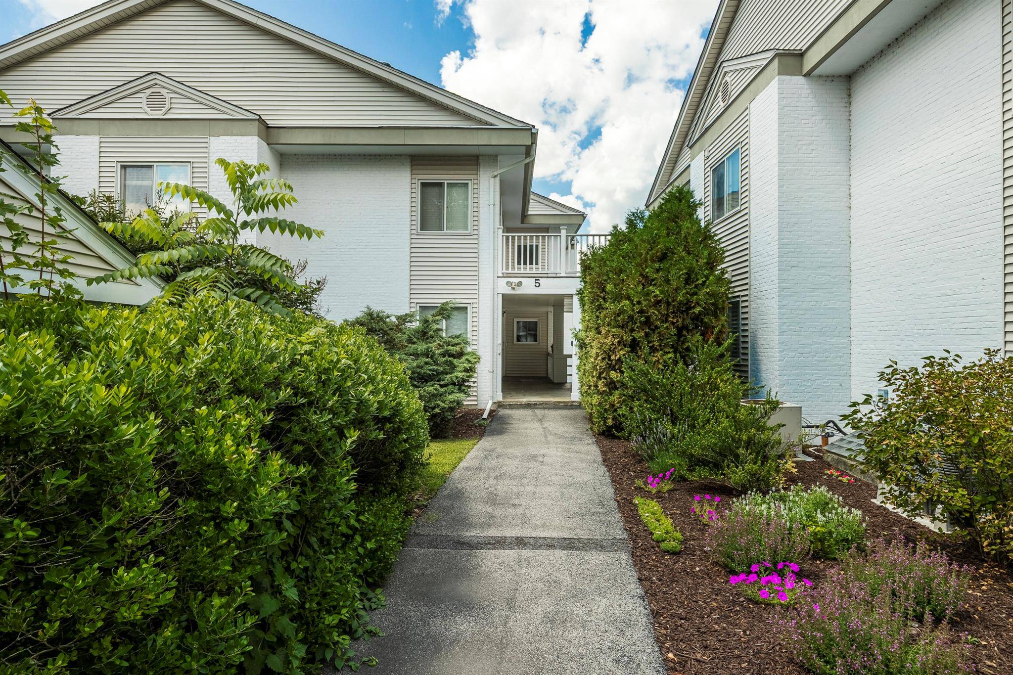 The living really is easy in this totally renovated, pristine, spacious and bright two bedroom, two bath condo located in the Bennett Common Community.