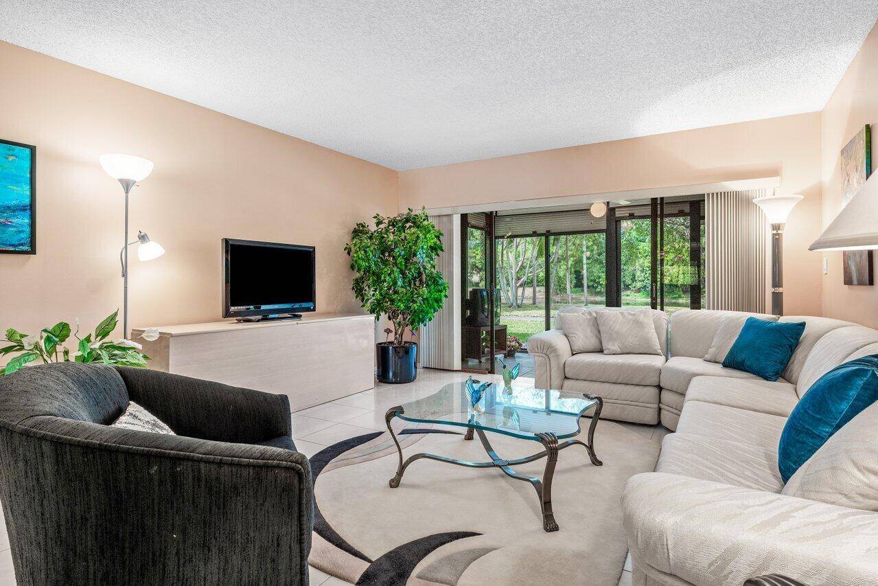 VERY MOTIVATED SELLER 1st floor furnished lakefront garden CONDO Glass enclosed patio for extra living space Loaded with closets for storage Eat In Kitchen Can lease 1st year New ROOF ...