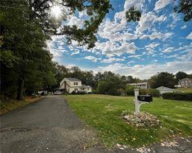 Welcome to this charming colonial home situated on an expansive.
