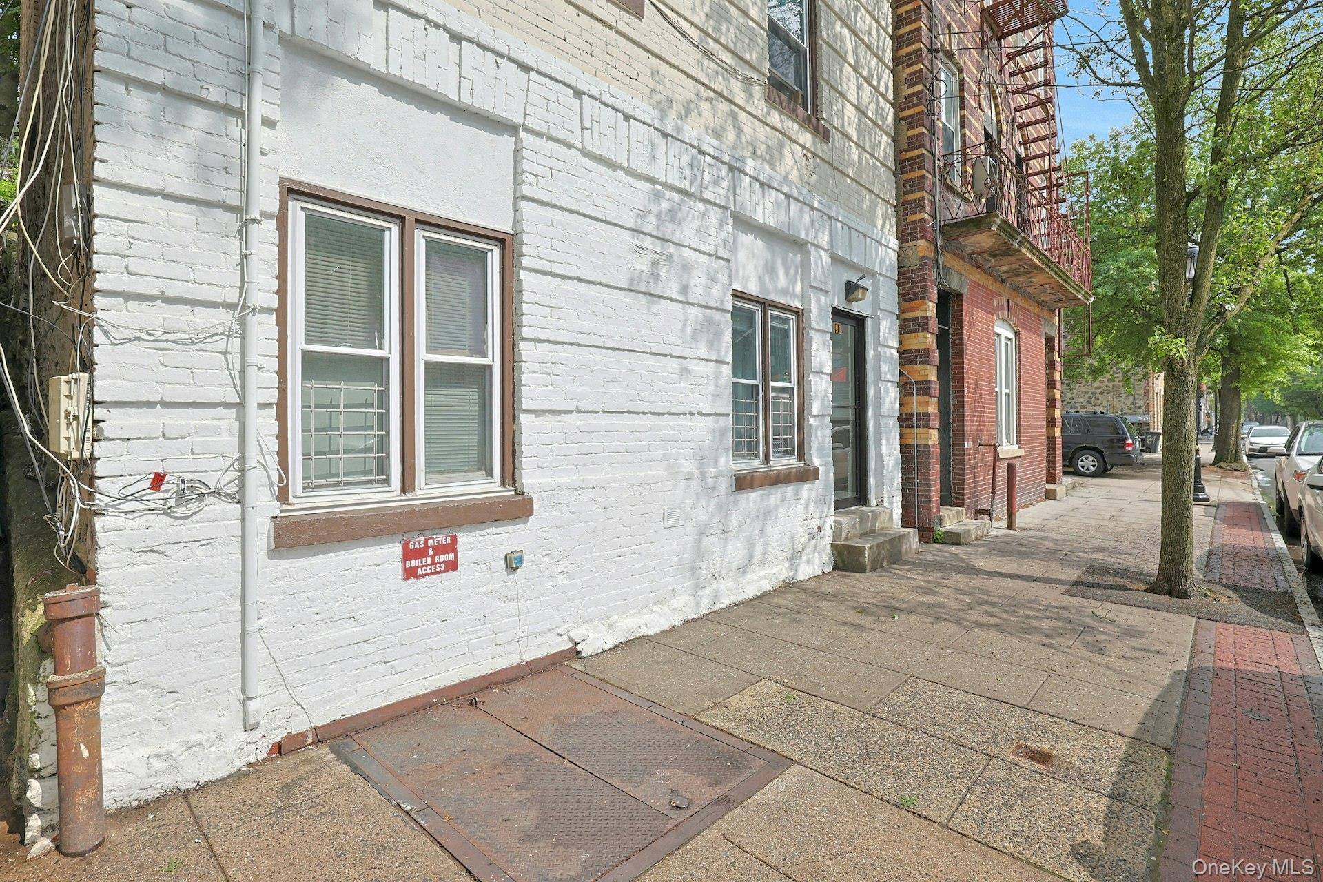 Investors take notice ! This three family property features two one bedroom units and one two bedroom unit, each with its own gas boiler.