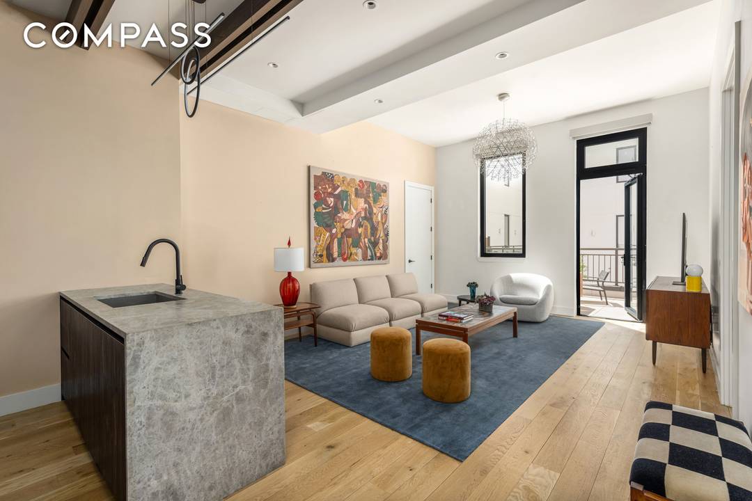 Residence 2C at The Salvation Lofts 10 Quincy Street is an oversized one bedroom, one bath home defined by scale, light, and seamless indoor outdoor living.
