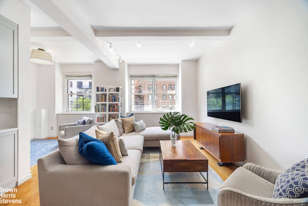 Apartment 4G is a substantial prewar two bedroom home spanning 1, 335 square feet with ceiling heights approaching 10 feet.