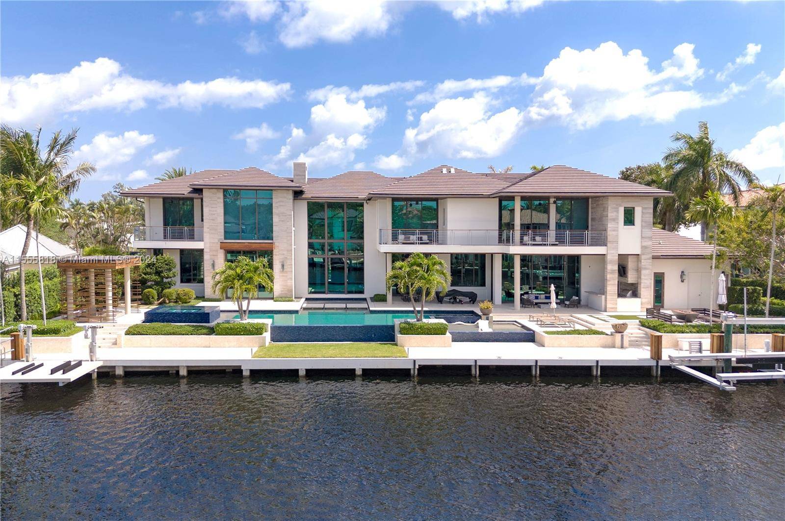 Discover this exclusive luxury waterfront estate in Bay Colony, Ft Lauderdale, designed by renowned Stofft Architects.