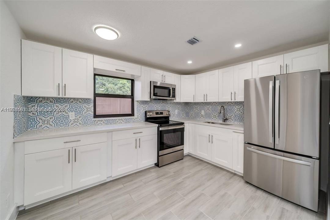 STUNNING RENOVATION NEAR HOLLYWOOD BEACH NO HOA This isn't just a home ; it's a lifestyle.