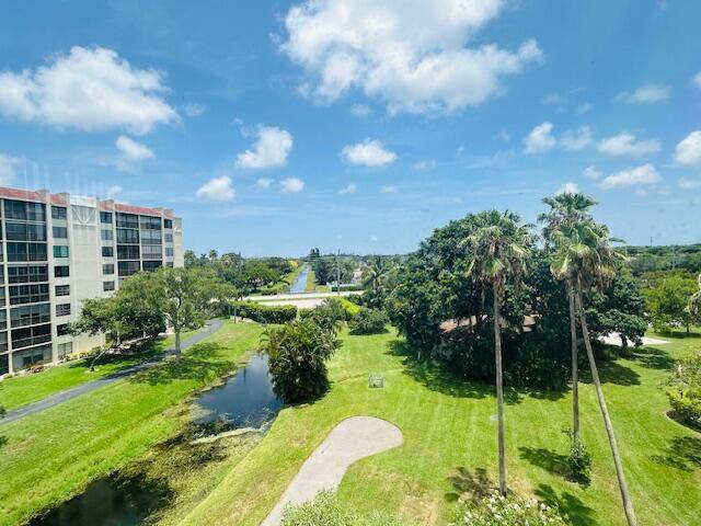 Live the South Florida Dream in this beautiful Corner Water View home with an enclosed porch in this popular 55 socially active community in Delray Beach.
