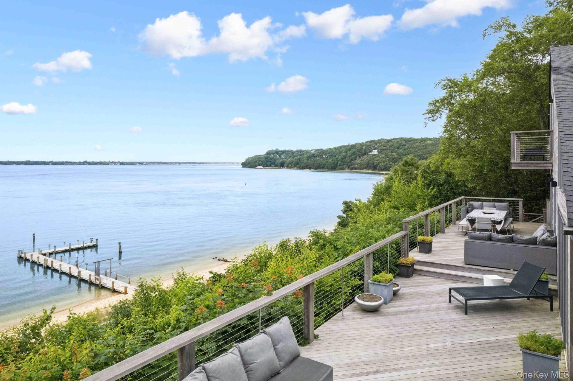 Waterfront Compound with 2 Docks Located on one of the most prestigious beaches on all of Shelter Island is this expansive compound with all the amenities one would want.