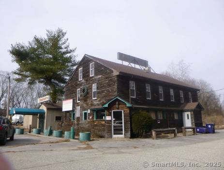Former restaurant with 2 leased apartments above.