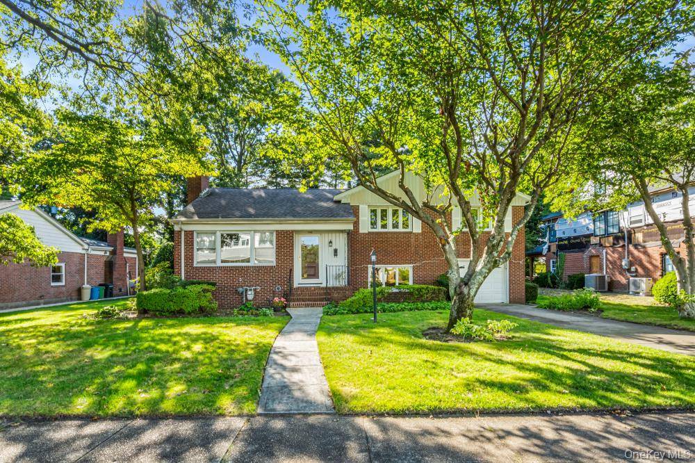 A Wonderful split level home living room w fireplace, formal dining room, updated EIK, Family room w powder room leads out to a spacious patio and large backyard and the ...