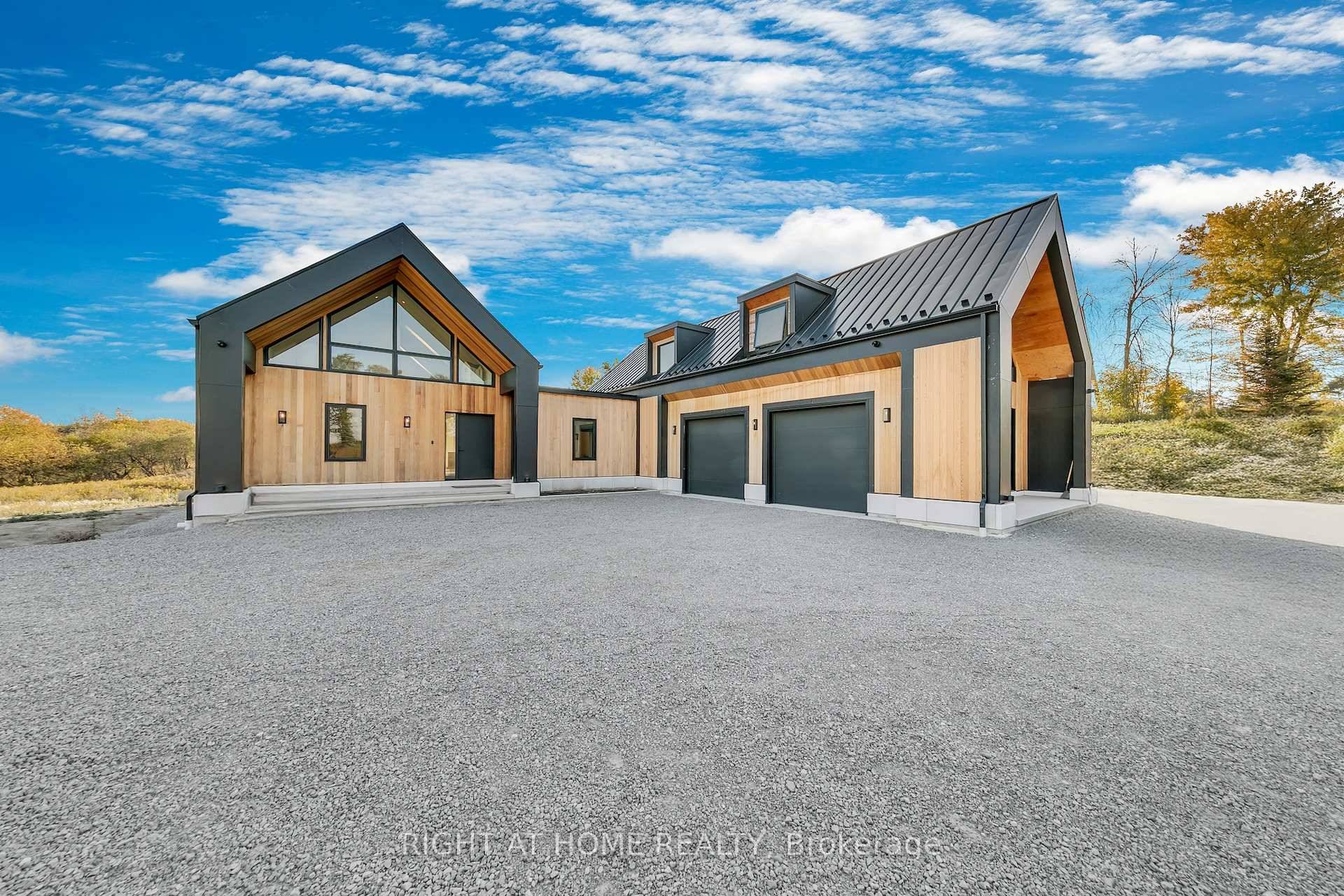 Discover the perfect blend of modern design and country serenity in this new A frame cedar farmhouse set on over 65 acres of picturesque agricultural land.
