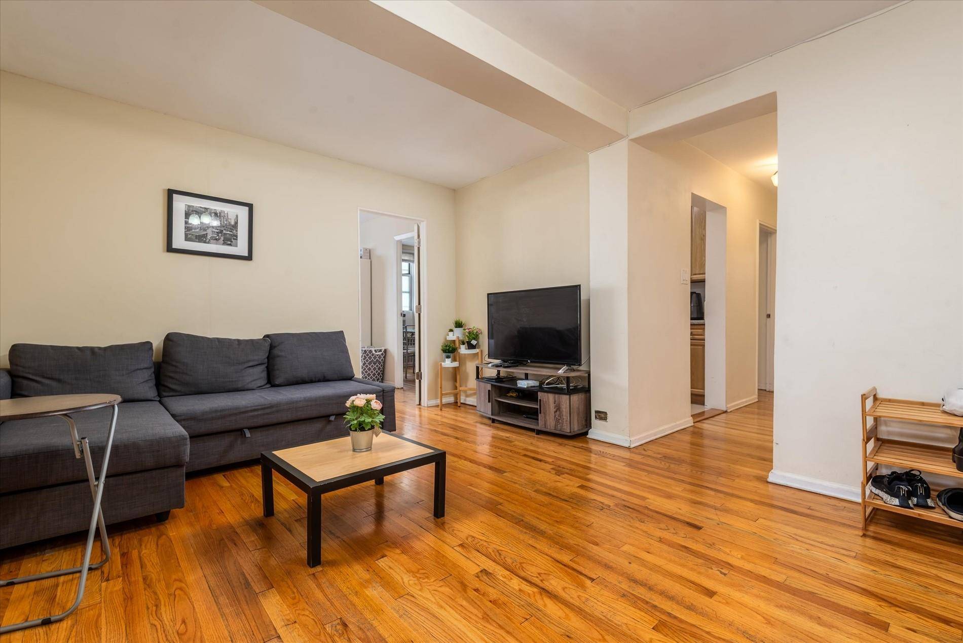 Welcome to this charming and inviting 2 bedroom co op located in the heart of vibrant Woodside.