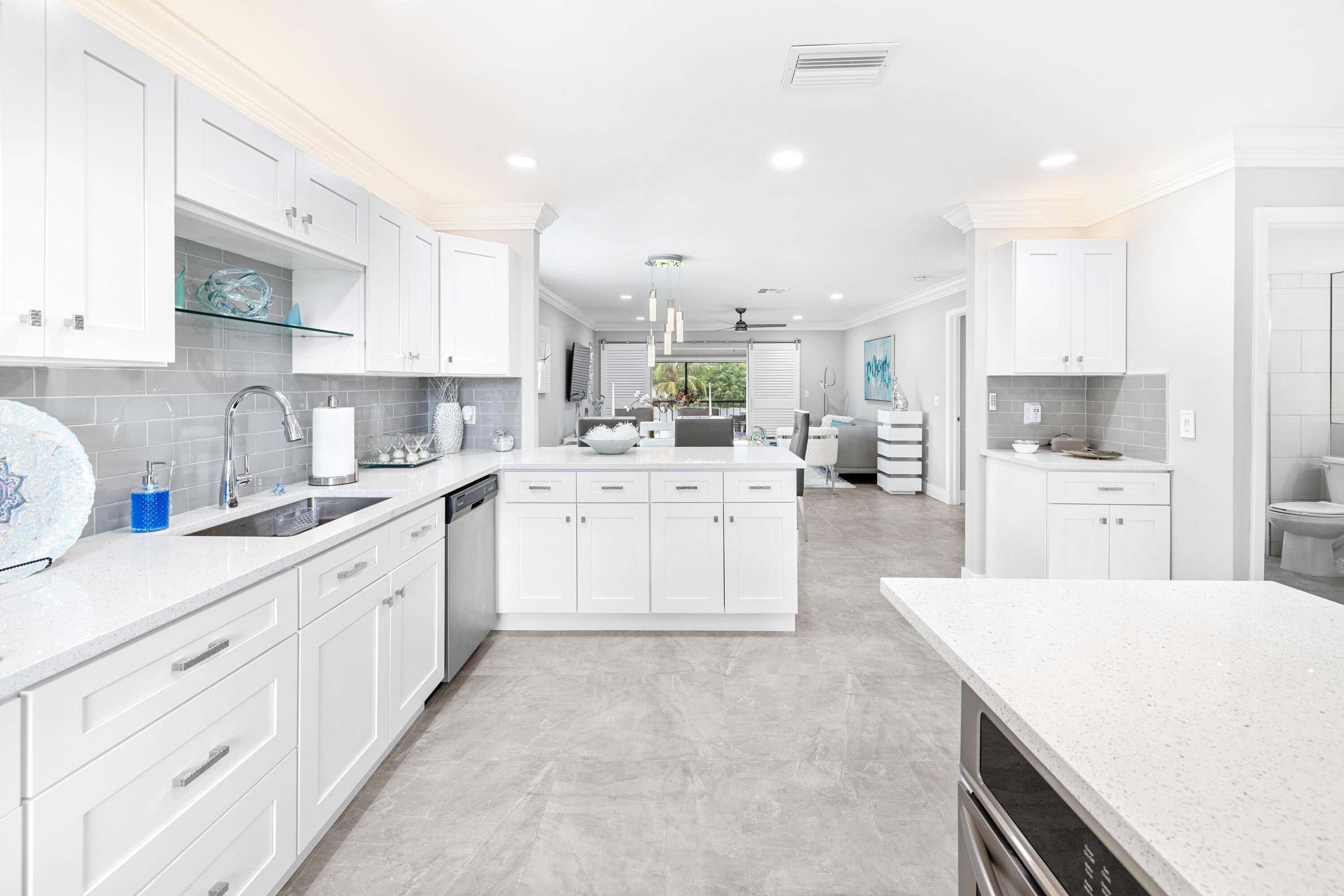 Stunningly renovated 2BR 2BA corner unit in Boca Lago, offering serene golf course view, natural light, and total privacy.