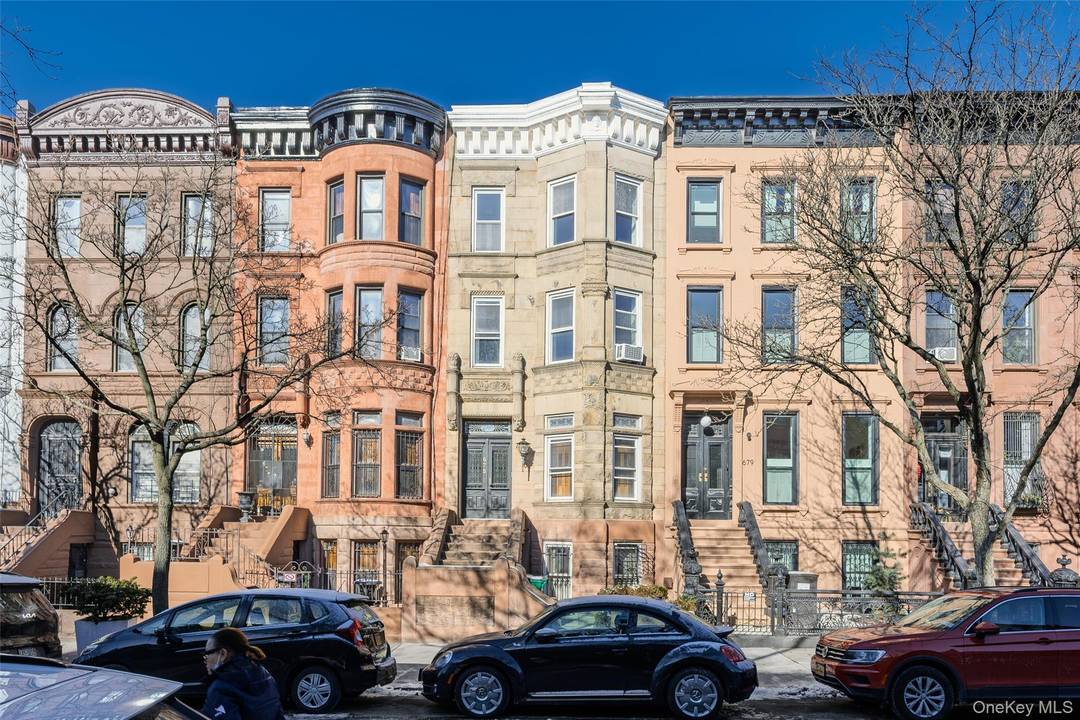 Exceptional 1899 Brownstone two family on pristine tree lined block in the heart of Stuyvesant Heights Historic District.