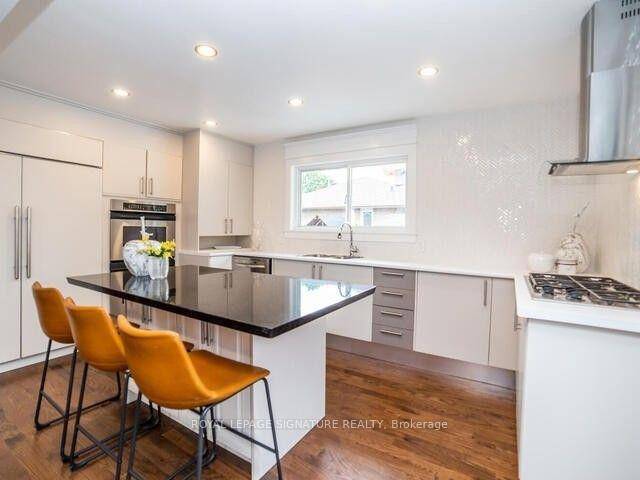 Discover this beautifully renovated main floor unit offering three generously sized bedrooms and a spacious, modern kitchen perfect for everyday living and entertaining.