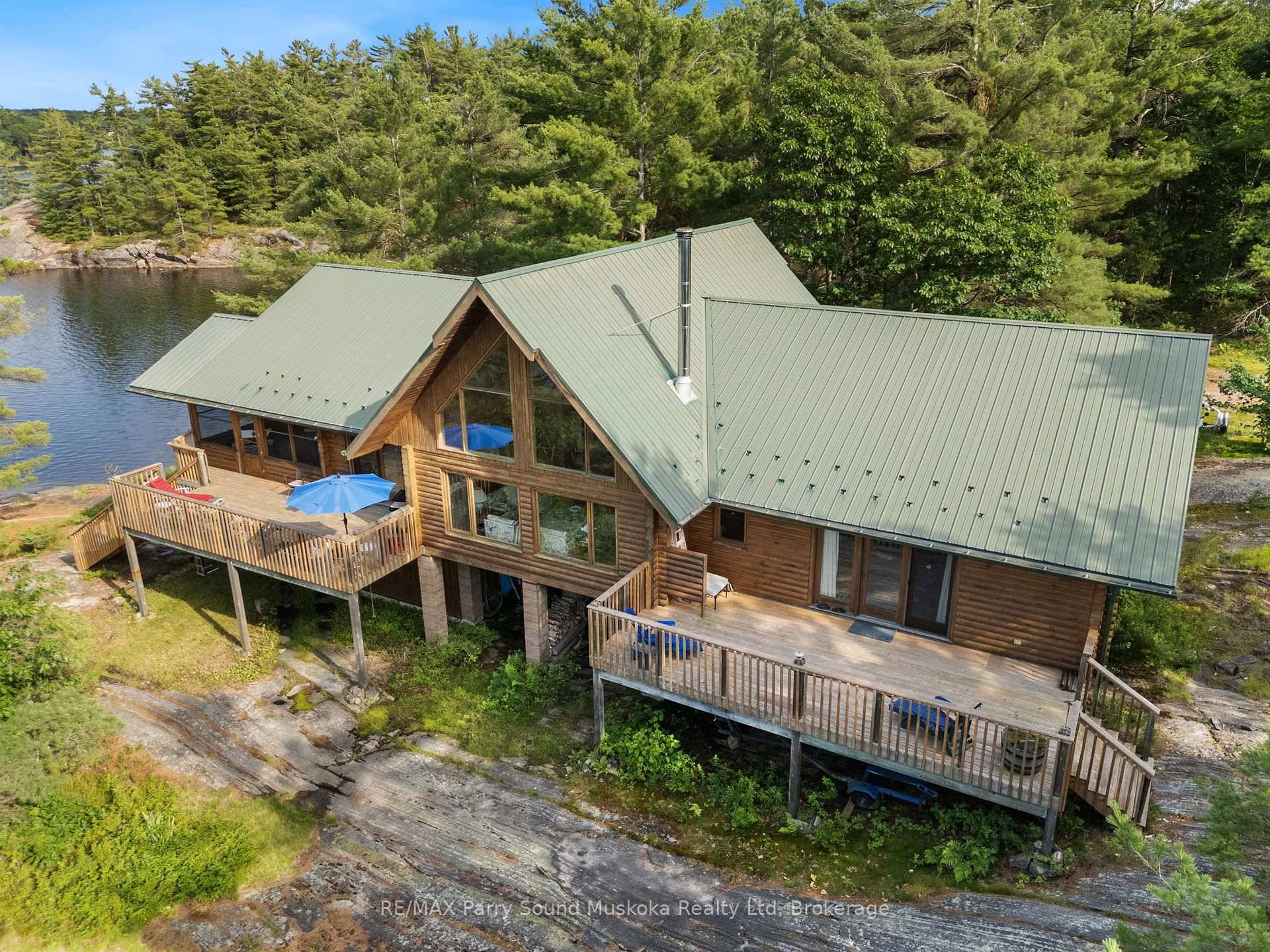 Nestled in the serene beauty of Georgian Bay, this water access, 2081 sq ft Caledon Log 3 bed, 3 bath cottage offers a rare opportunity for a peaceful retreat.