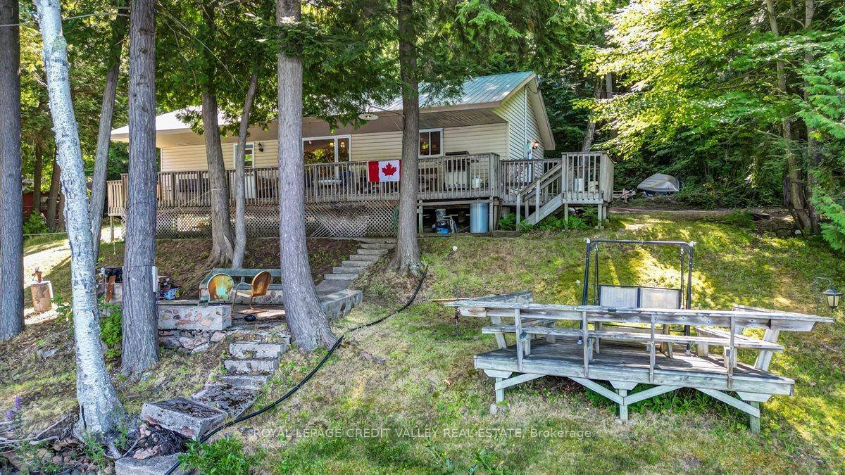 Discover tranquility at this stunning 3 season waterfront cottage on beautiful Trout Lake.