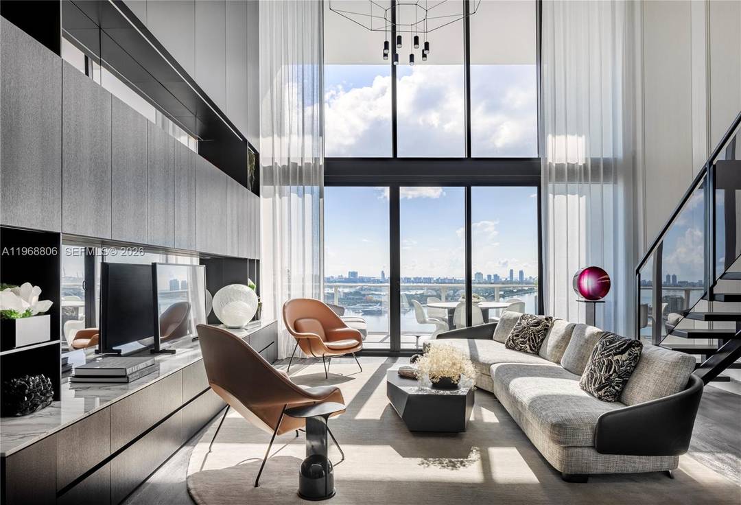 A masterful blend of architecture and refined design, this striking loft style residence rises 22 floors above the city within the renowned Ten Museum Park, conceived by acclaimed architect Chad ...