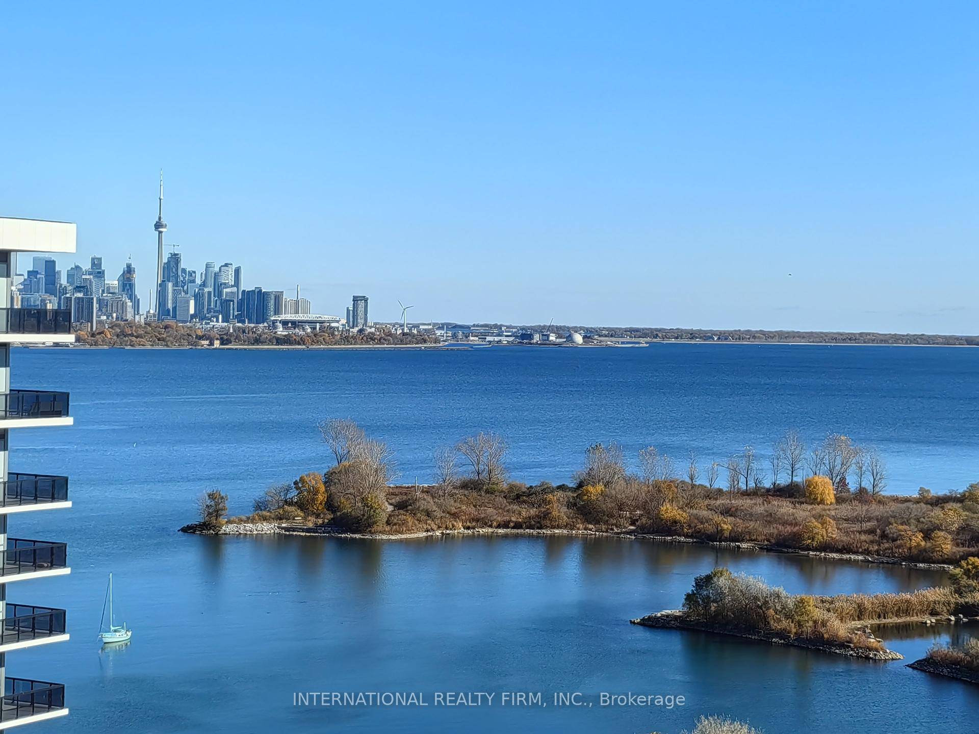 Modern 1 1 Bedroom Unit Featuring Floor To Ceiling Windows With Breathtaking Views Of Lake Ontario And The Toronto Skyline ; Open Concept Layout With Sleek Kitchen, Quartz Countertops, S ...