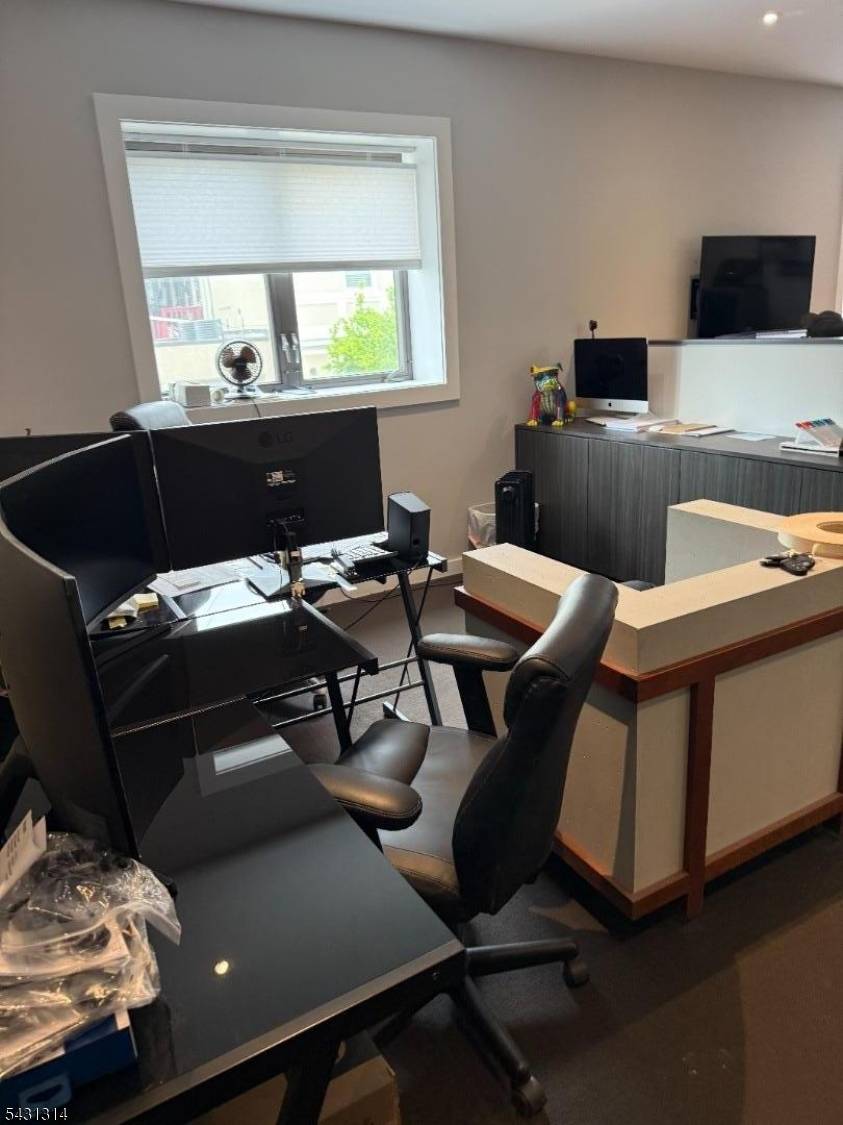 commercial building located on corner lot has been updated with newer windows door, newer kitchen, new baths, newer office space, newer flooring.