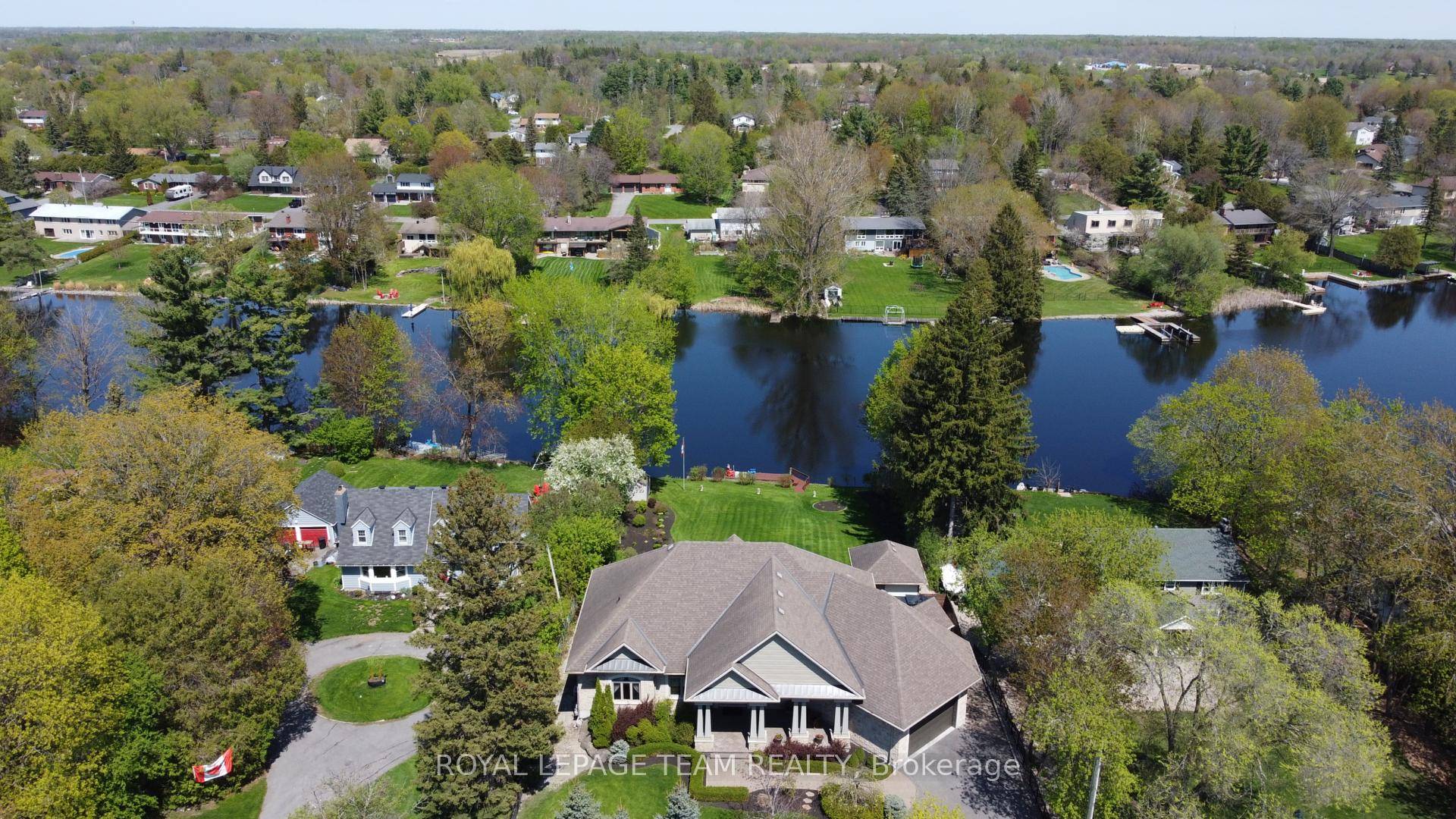 OPEN HOUSE SUNDAY MAY 25TH 2 4PM Exquisite Waterfront Estate in the Heart of Manotick on the Rideau River.