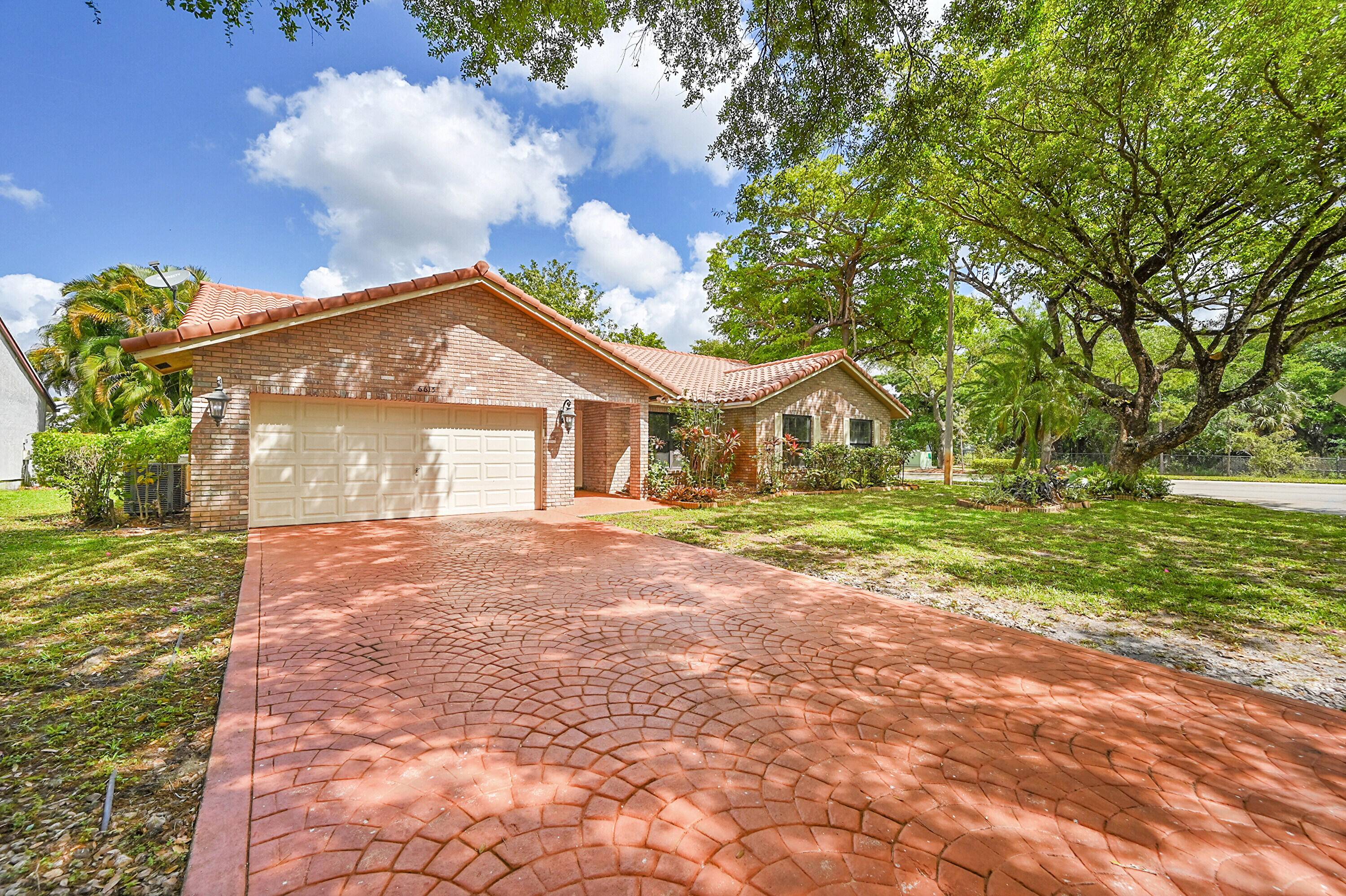 Discover this stunning 4 bedroom, 2 bathroom pool home available for annual rent in Coral Springs.