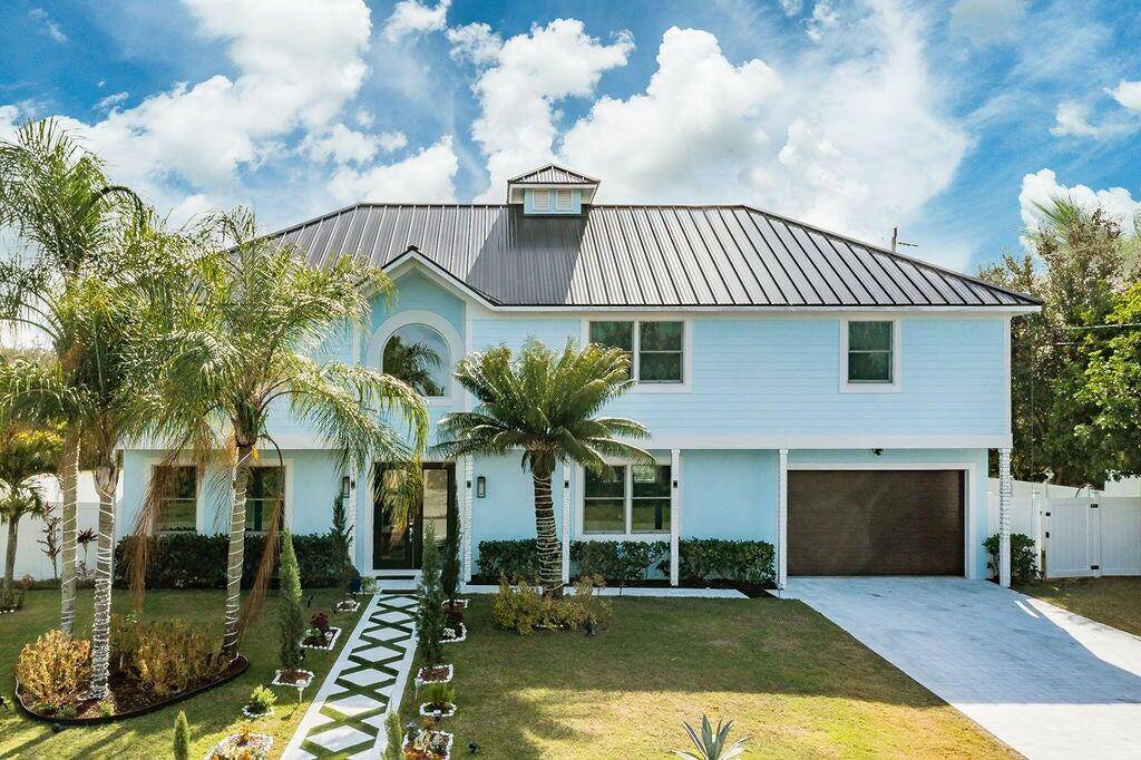 Spectacular, 2 story home is a masterpiece of design functionality, situated on a prime corner lot.