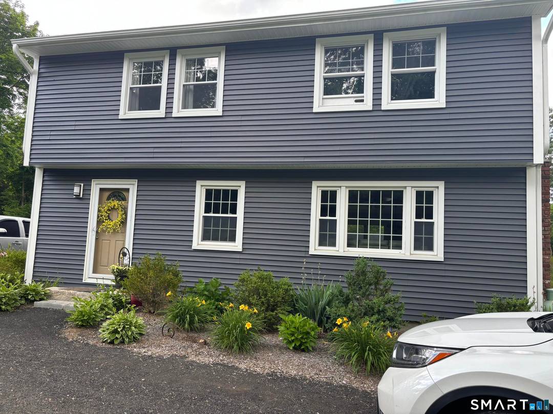 Updated 3 bdrm, 3 bath colonial including master bath, with open concept, hardwood floors throughout, kitchen with an island, and new Kitchen Aid appliances on 1 level acre.
