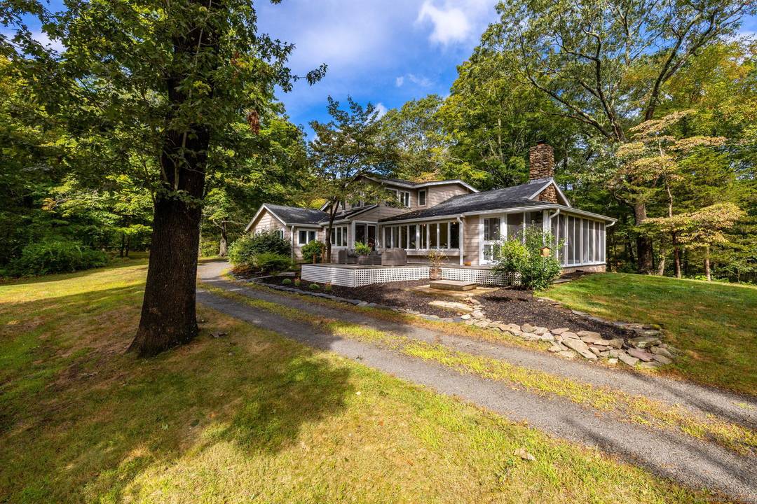 Welcome to 154 Wilbur Ln, a truly distinctive property that sets itself apart from the rest providing over four and half acres of privacy.