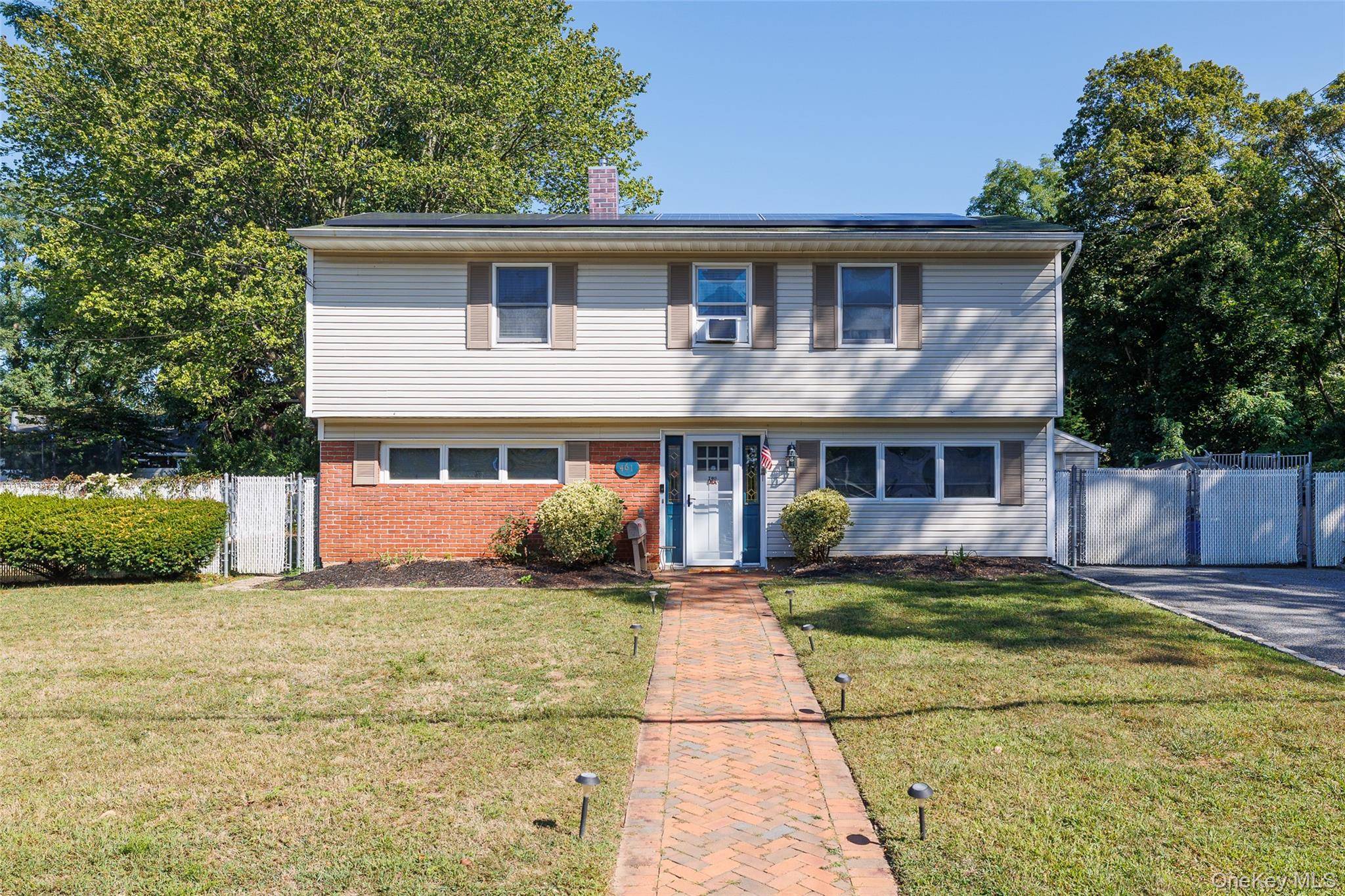 Located in the desirable Village of Babylon, this beautifully maintained 4 bedroom, 2 bath Splanch sits on the edge of scenic Southards Pond, offering peace, and privacy.