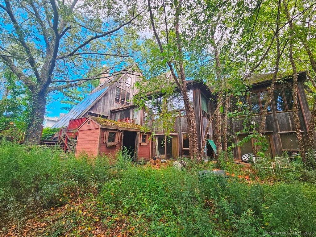Welcome to this stunning contemporary residence set on a private, tree lined one acre lot.