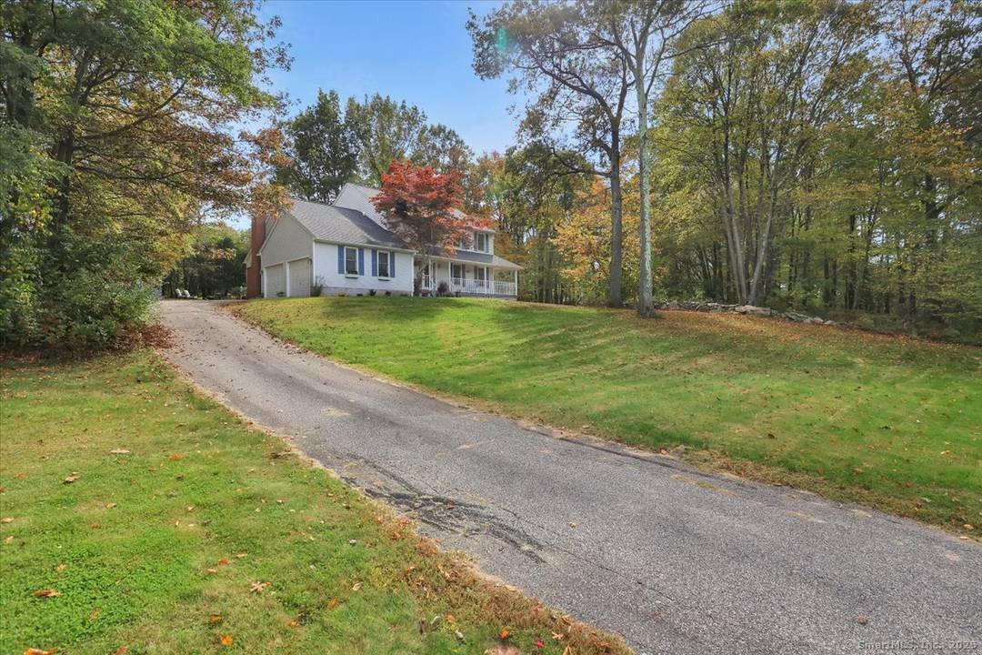 Welcome home to this beautifully maintained 3 bedroom, 2 full and 2 half bath colonial nestled on over an acre in one of Tolland's most peaceful wooded neighborhoods.