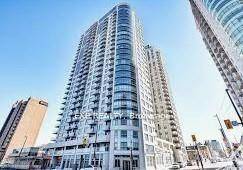 Modern Open space studio unit featuring large windows, a private balcony, and a designer kitchen with stainless steel appliances.