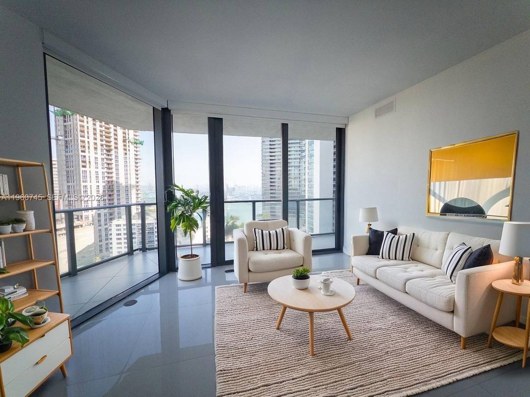 Experience refined waterfront living in this stunning 3 bedroom, 2 bath residence at Paraiso Bayviews, located on the 17th floor with breathtaking bay and skyline views from every angle.