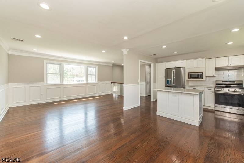 Truly a one of a kind property set on a full acre, offering exceptional outdoor amenities including a versatile sports court designed for pickleball, tennis, volleyball, and even batting practice.