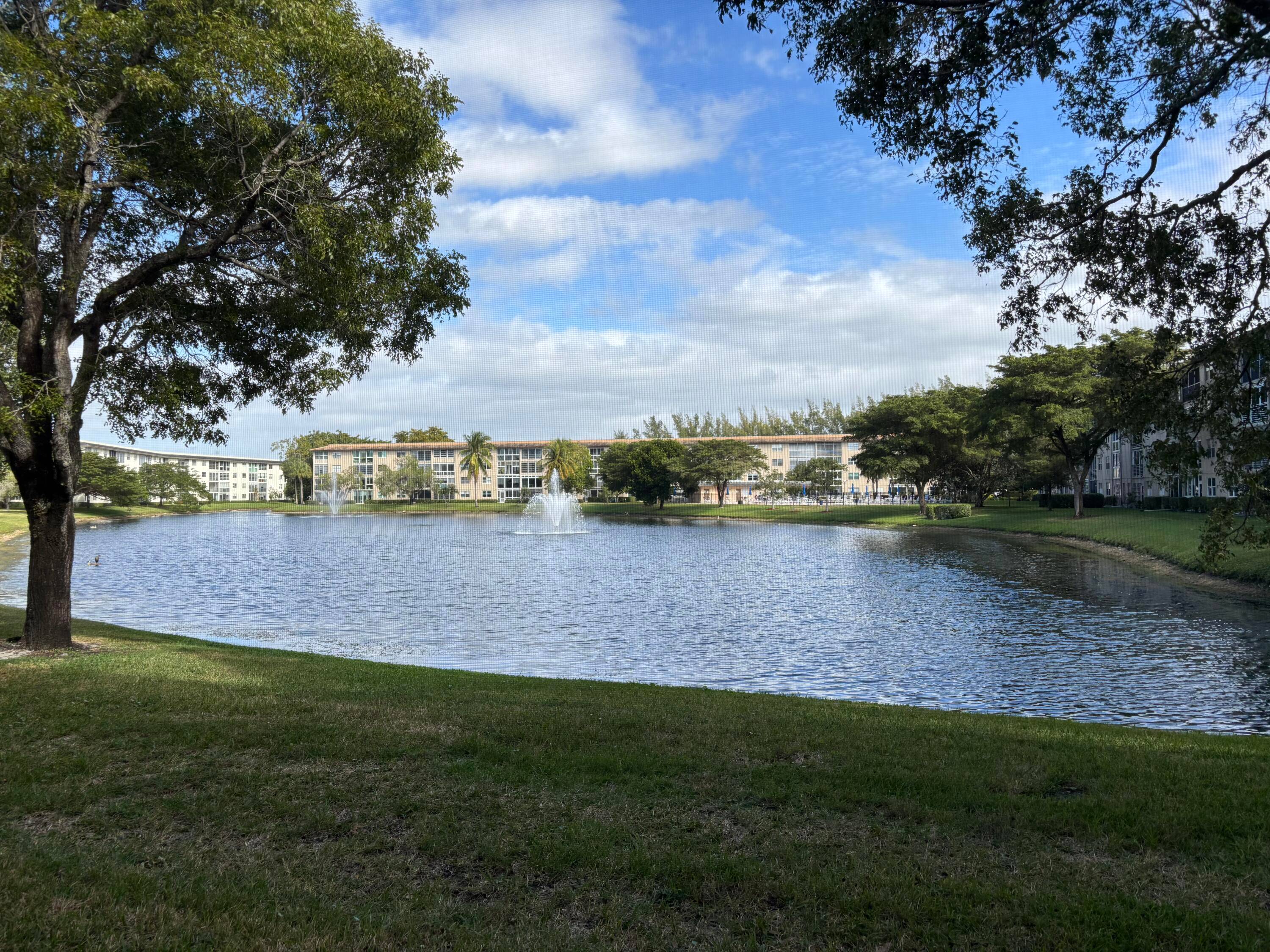 Wow, what a view ! This 2 bedroom, 2 bath deluxe ground floor condo in a gated community features a screened patio with stunning views of the lake, fountain, and ...