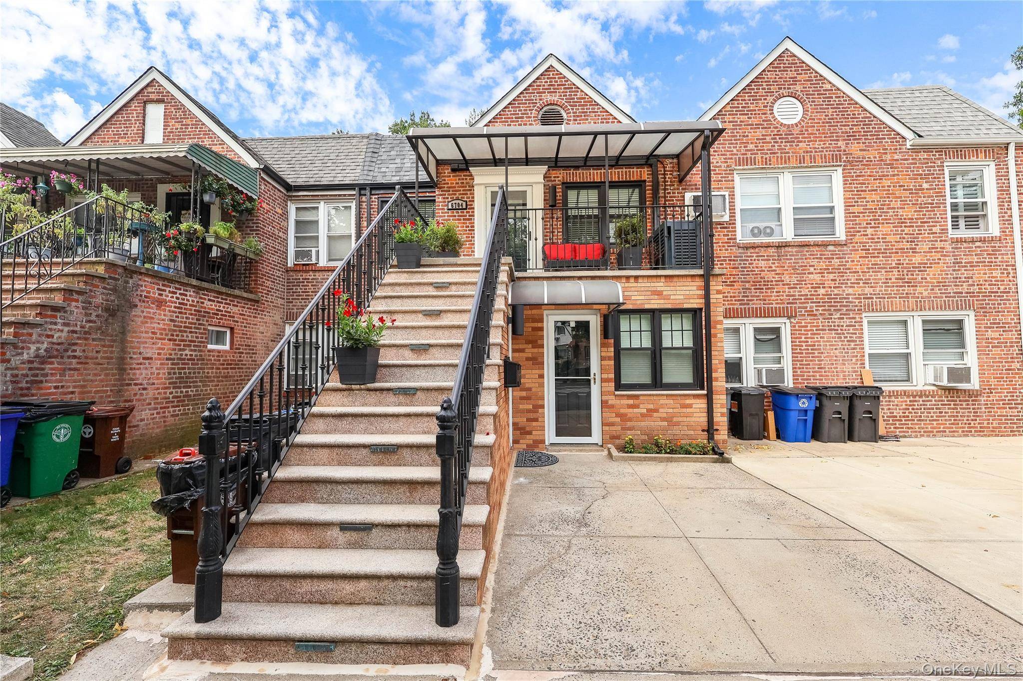 Impressively renovated 2nd Floor Apartment in the heart of Forest Hills, featuring striking black accented features and stairway and a welcoming covered patio.