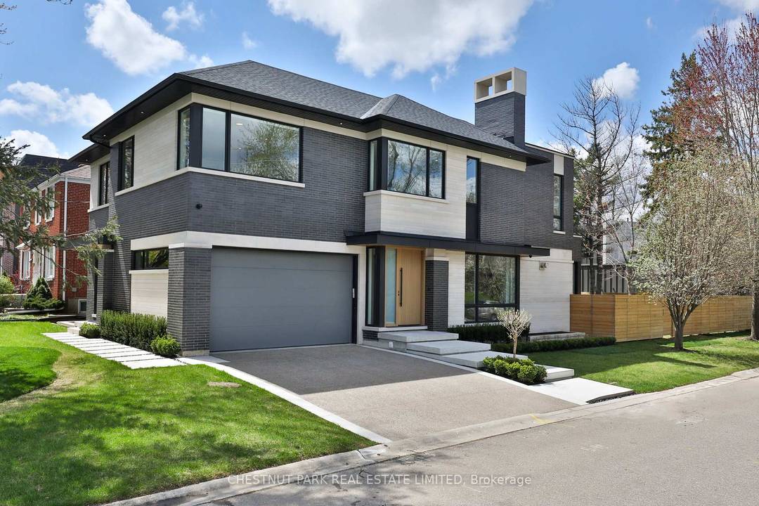 This newly built, custom contemporary residence is located on a private, tree lined street in a coveted pocket of Armour Heights.