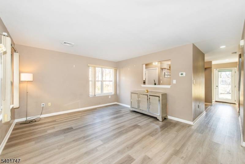 Discover the perfect blend of privacy and sunlight in this desirable end unit townhome, nestled in the serene, tree lined community of Hunting Meadow.